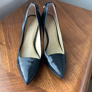 Black heels with tie decor on back